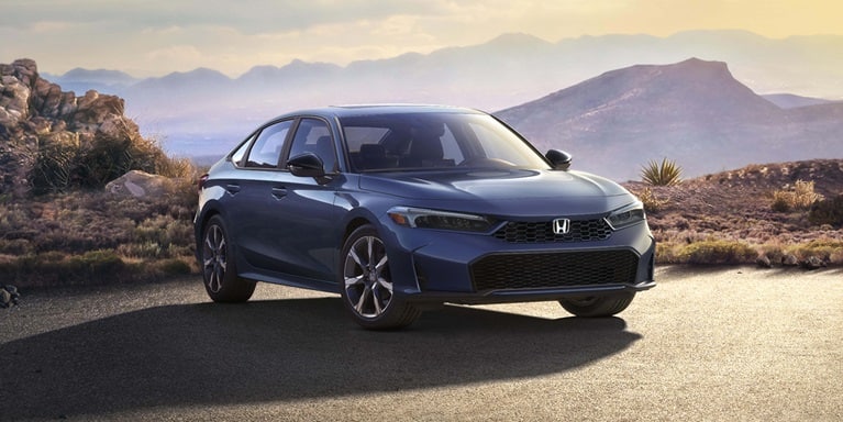 2027 Honda Civic Sedan Sport Touring Hybrid in Blue Lagoon Pearl front three-quarter view on a desert road (Compact Sedan)